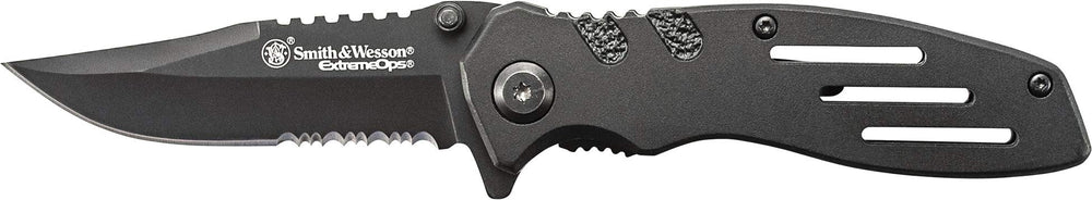 Smith & Wesson Extreme Ops blade close-up shows serrated clip point for tough tasks.