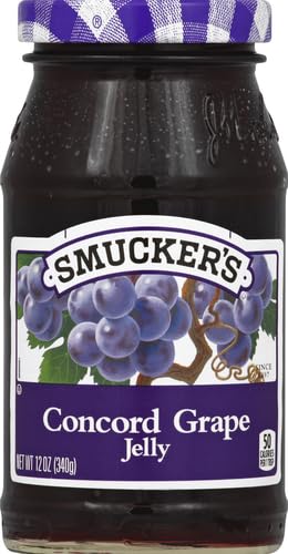 Smucker's Concord Grape Jelly spread on toast for breakfast.