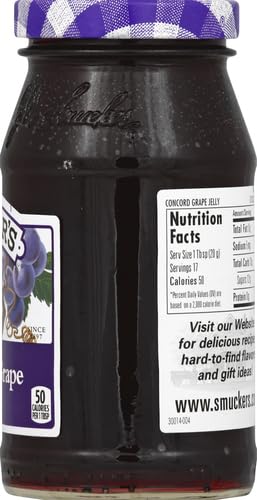 Smucker's Concord Grape Jelly displayed on a pantry shelf.