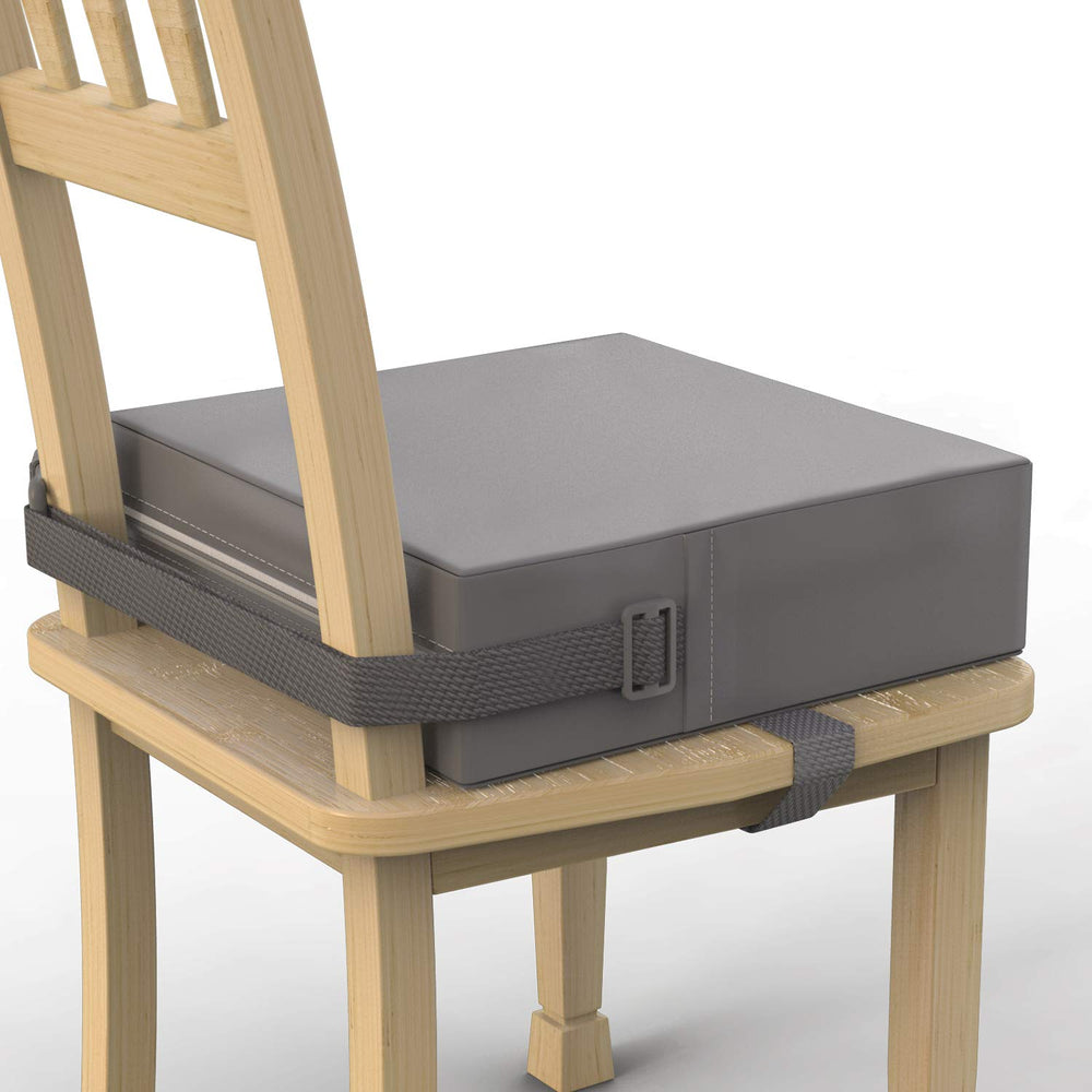 SMZCTYI toddler booster seat on grey dining chair provides stable mealtime seating