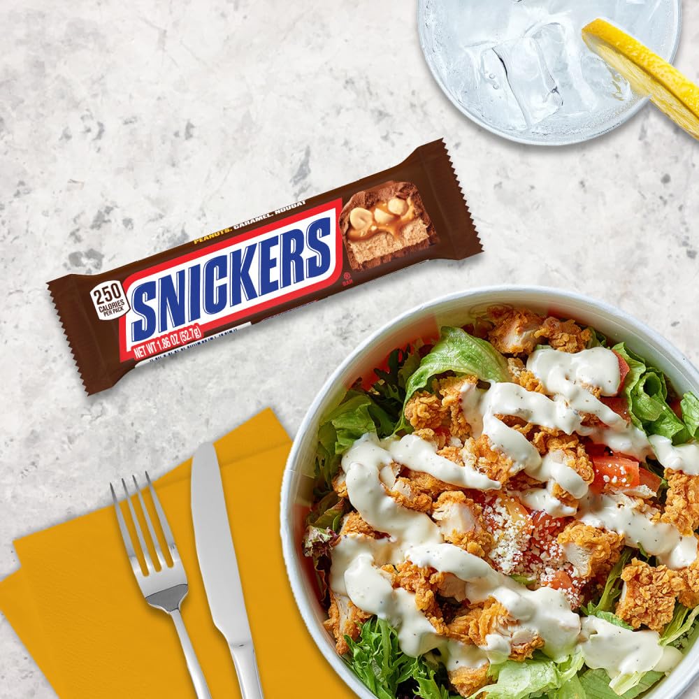 Snickers movie night display featuring multiple bars for family viewing.