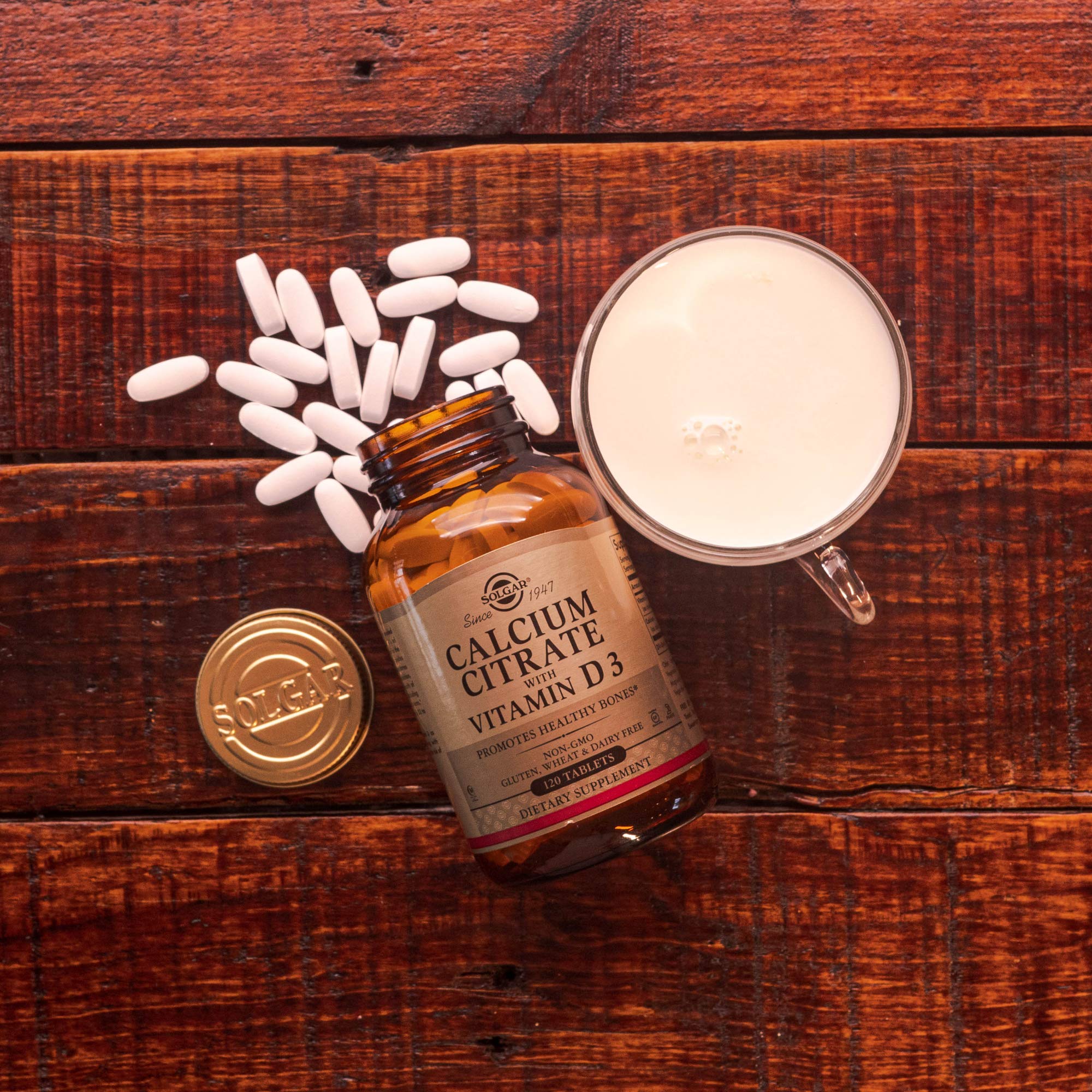 Solgar Calcium Citrate bottle icon highlights gluten-free and dairy-free compatibility