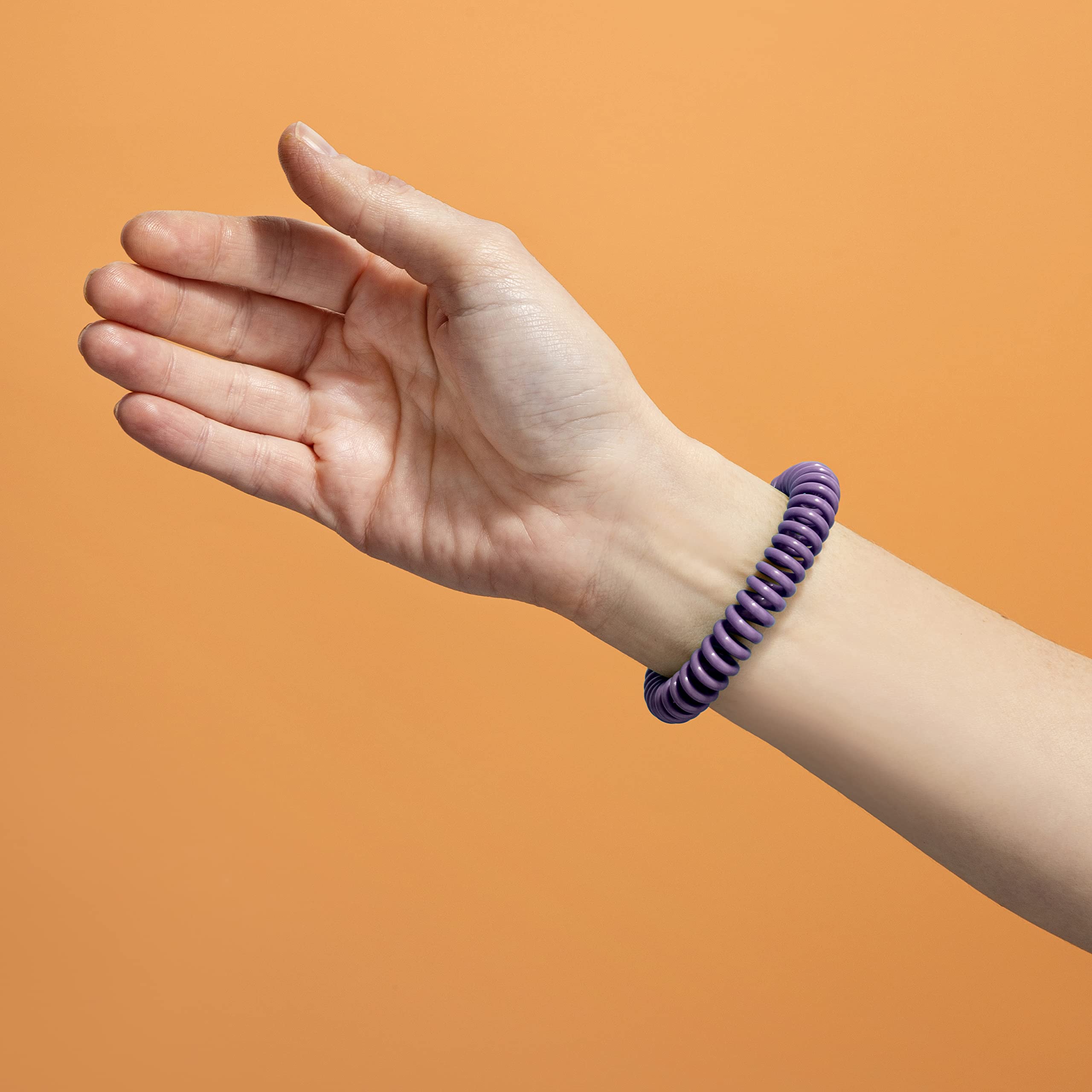 Close-up of SOULSATION bracelet showing adjustable fit.