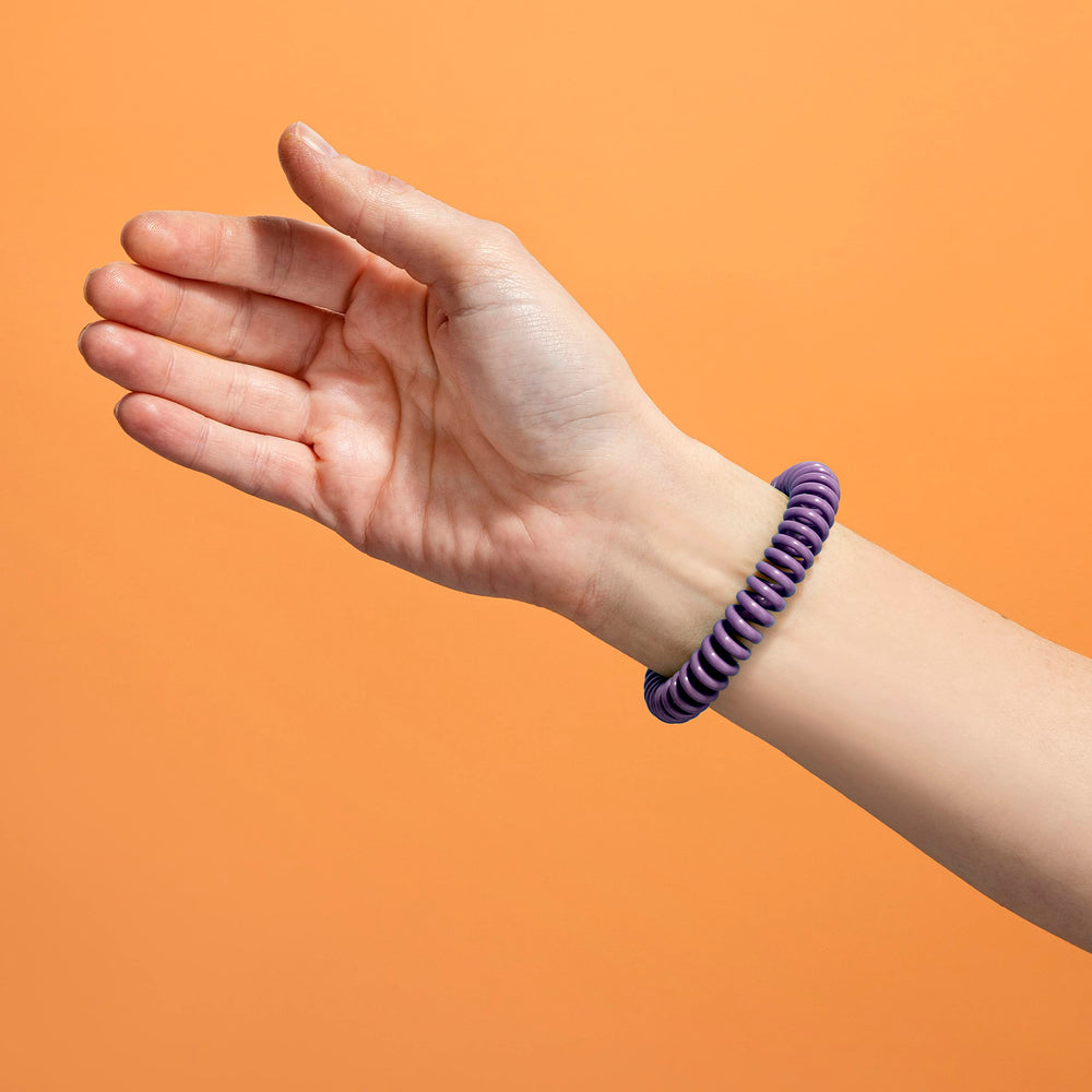 Close-up of SOULSATION bracelet showing adjustable fit.