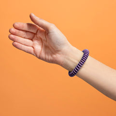 Close-up of SOULSATION bracelet showing adjustable fit.