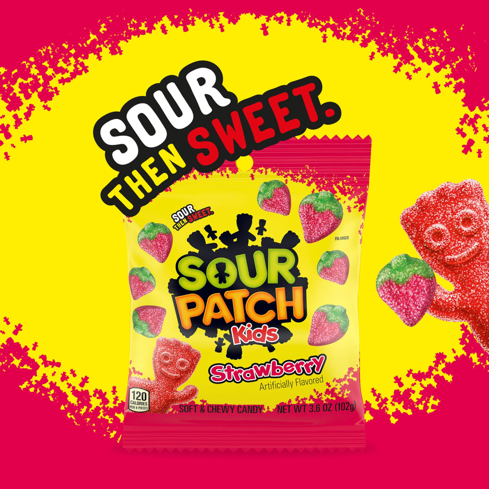 Sour Patch Kids strawberry candy at a movie night setup