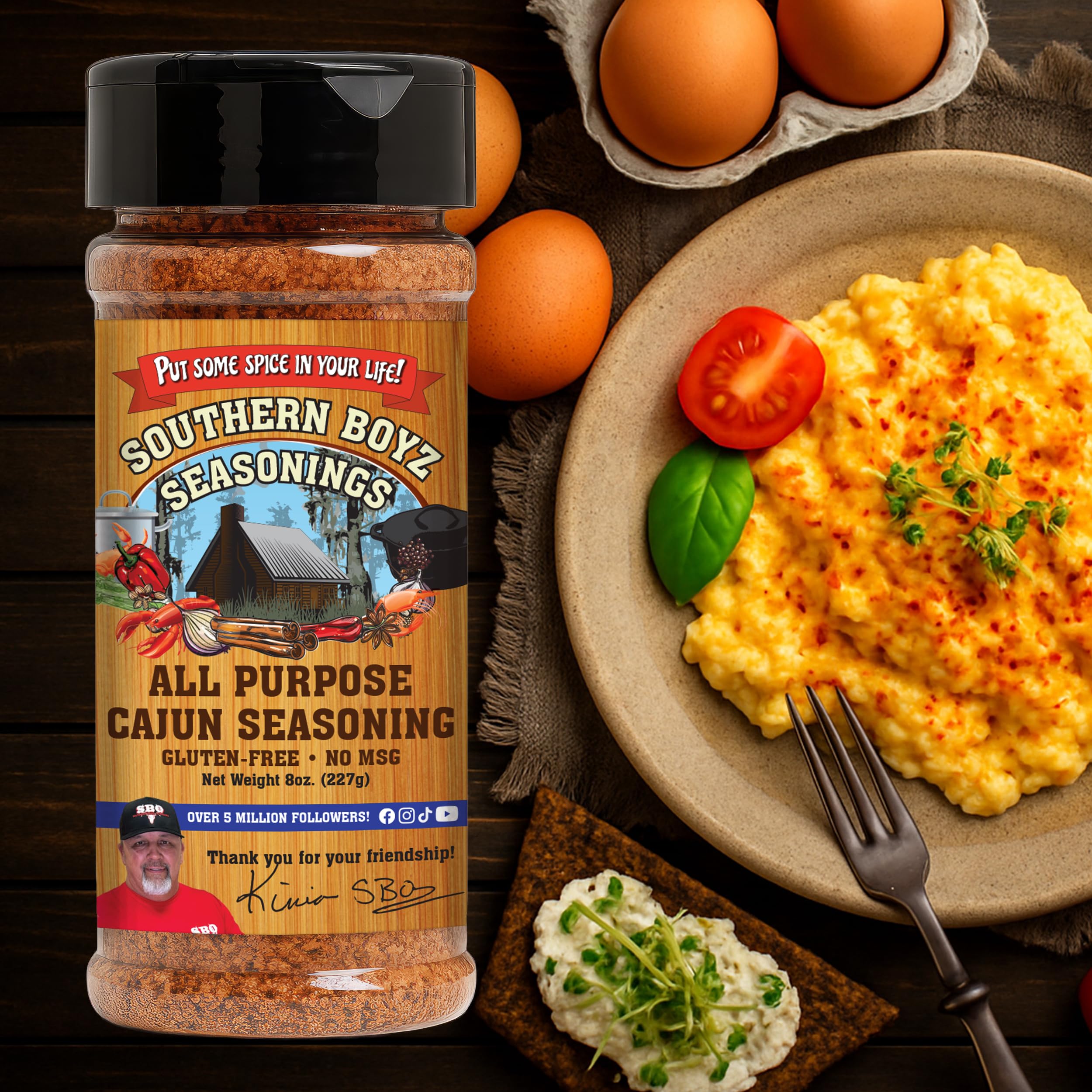 Southern Boyz Outdoors Cajun seasoning shaker beside a seafood boil pot.