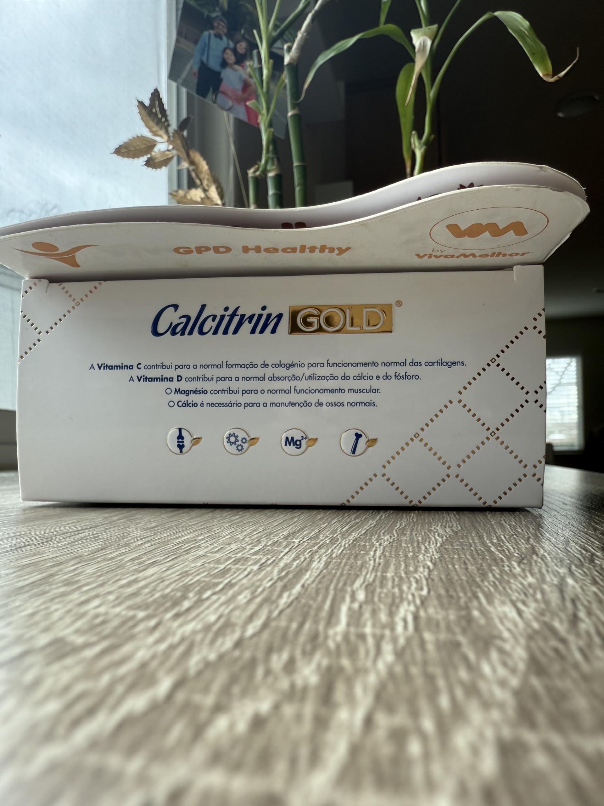 Soy Sano Calcitrin Gold bottle in a modern kitchen setting.