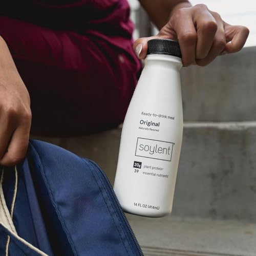 Soylent Original on-the-go holding a bottle for travel.