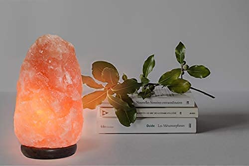 Ambient amber glow from Spantik lamp enhances room ambiance