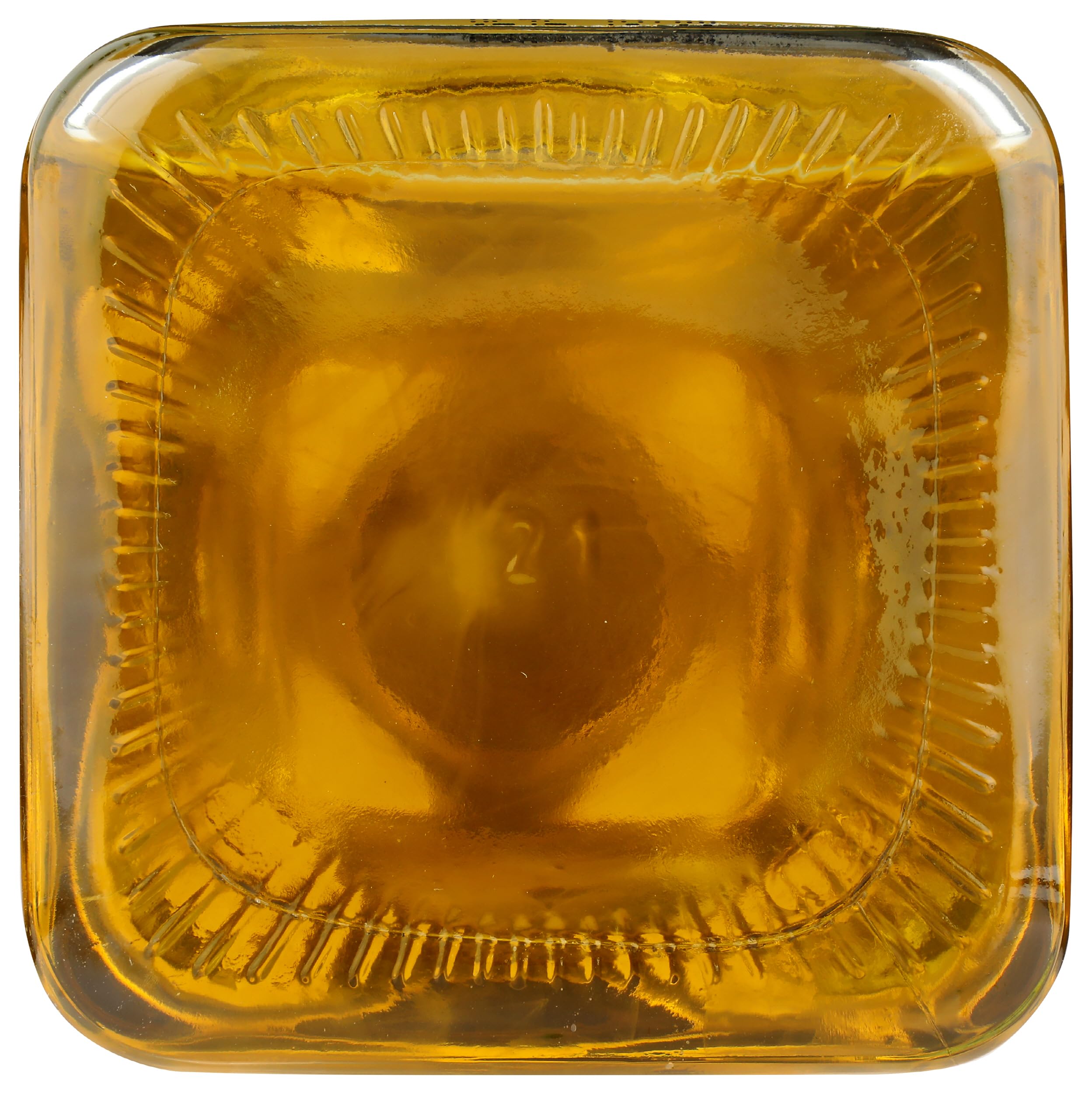 Spectrum Organic Sesame Oil bottle on pantry shelf with packaging variations.