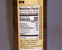 Spice Islands Premium Taco Seasoning on a plate with tacos suggests vibrant, restaurant-style seasoning.