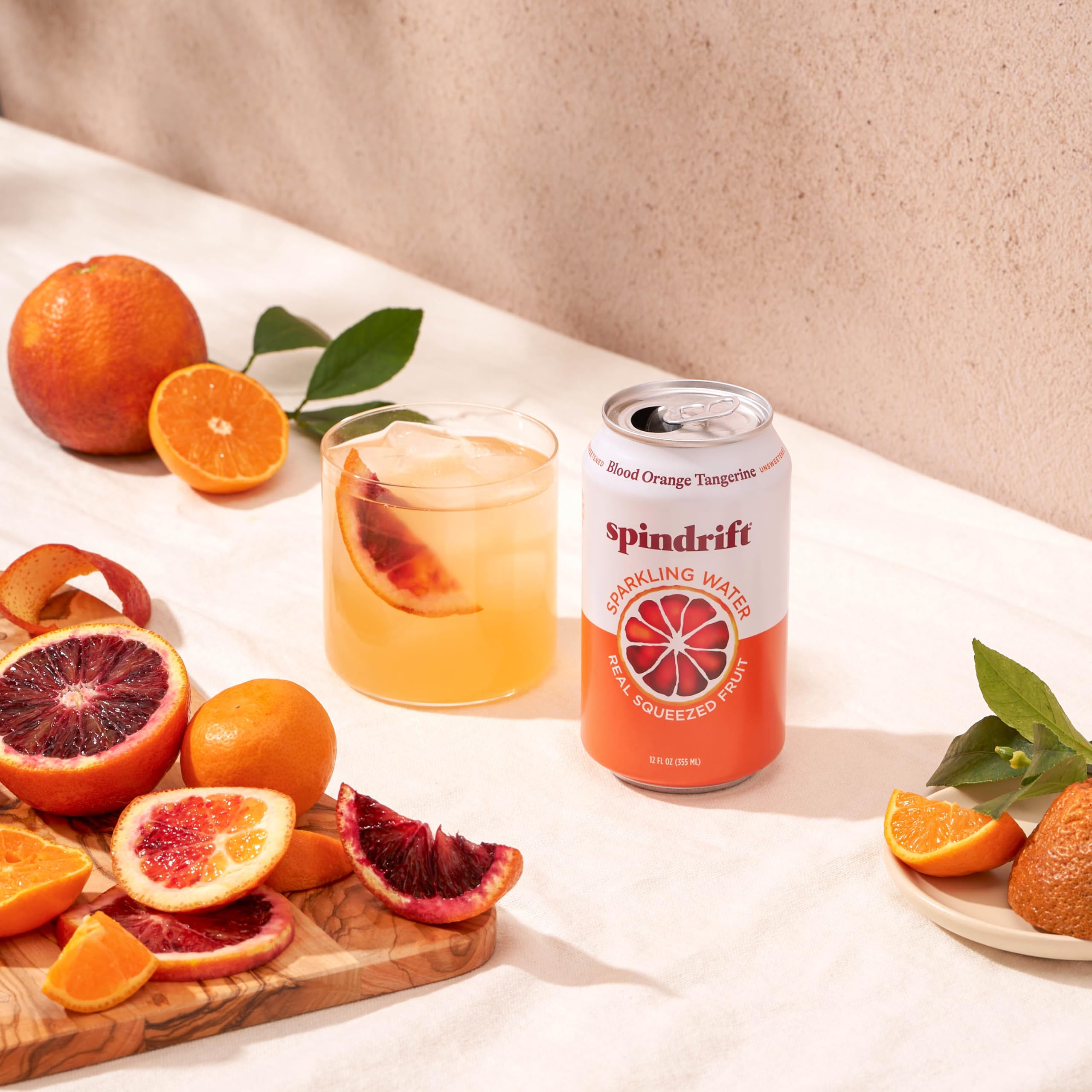 Spindrift blood-orange-tangerine pack-of-24 cans highlights gluten-free and Non-GMO features.