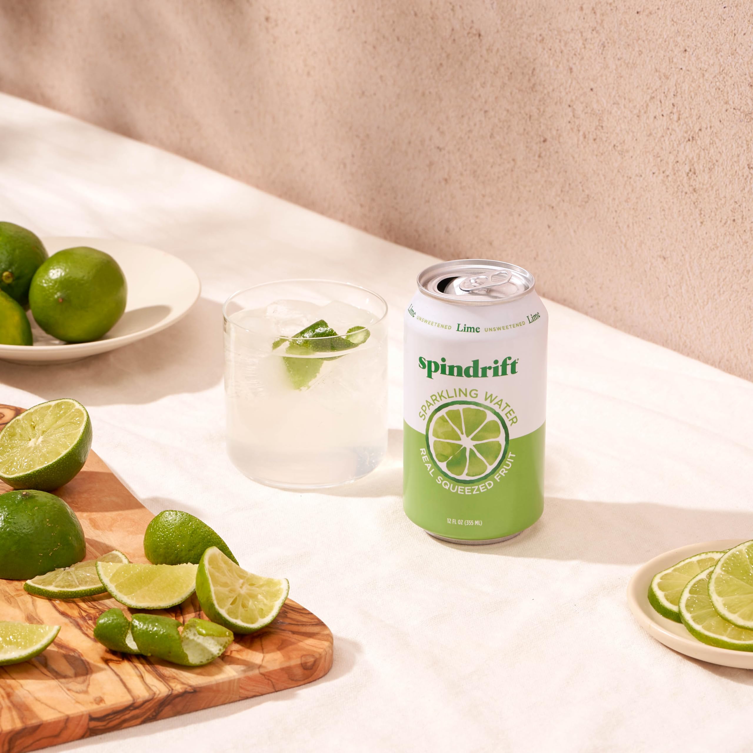 Pour Nojito into glass, mint aroma rising over sparkling lime.