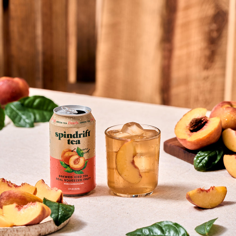 Chilled can of Spindrift Peach Green Tea in a cooler for gatherings.