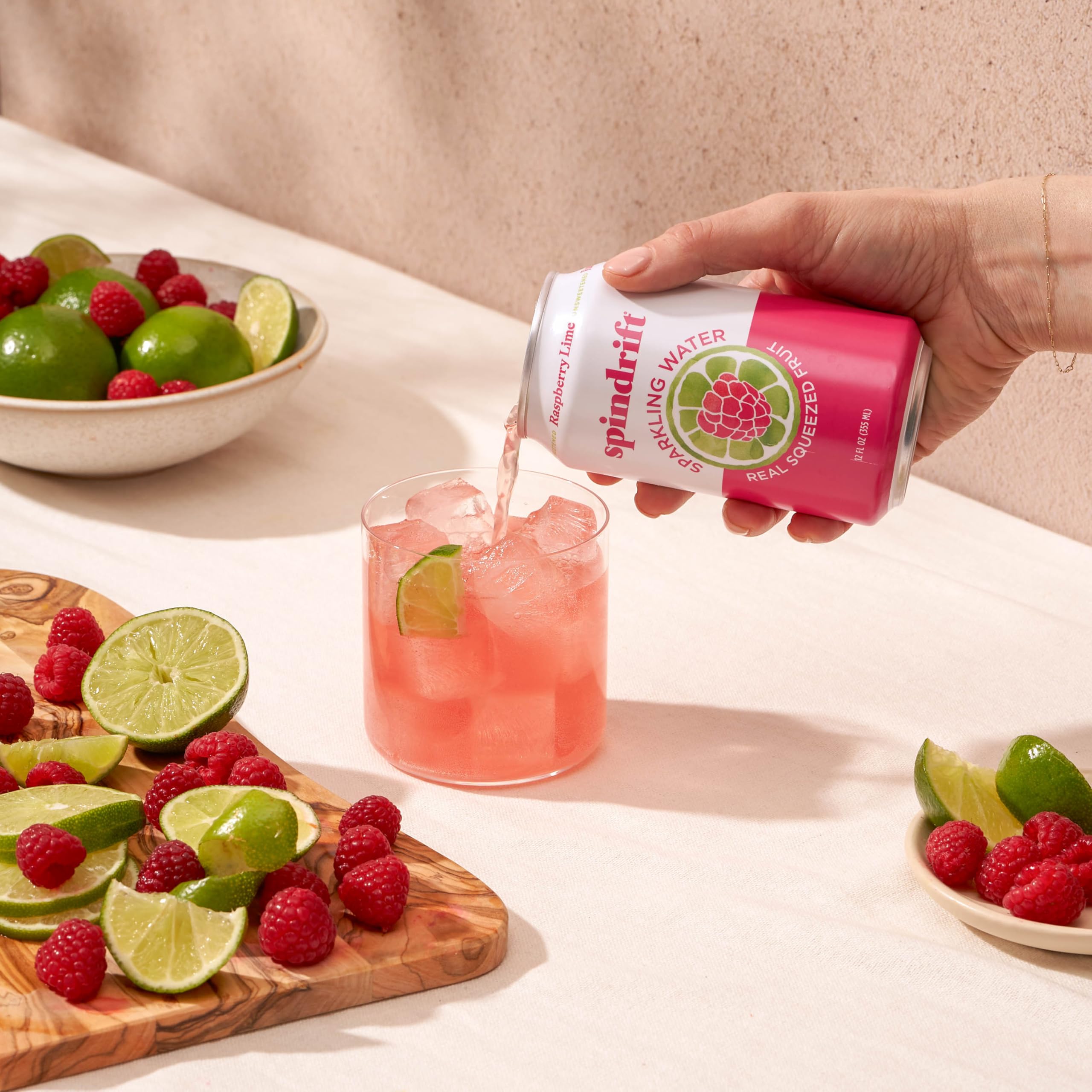Spindrift Raspberry Lime glass pour revealing lively bubbles