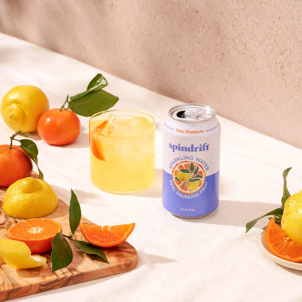 Spindrift Yuzu Mandarin fizz with ice, a refreshing option for meals.