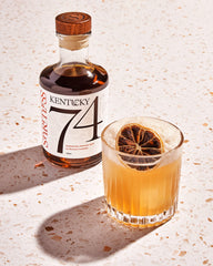 Spiritless Kentucky 74 pour into glass demonstrating easy integration into classic cocktails.
