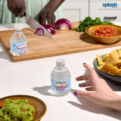 SPLASH REFRESHER Wild Berry in a glass showing bright color.