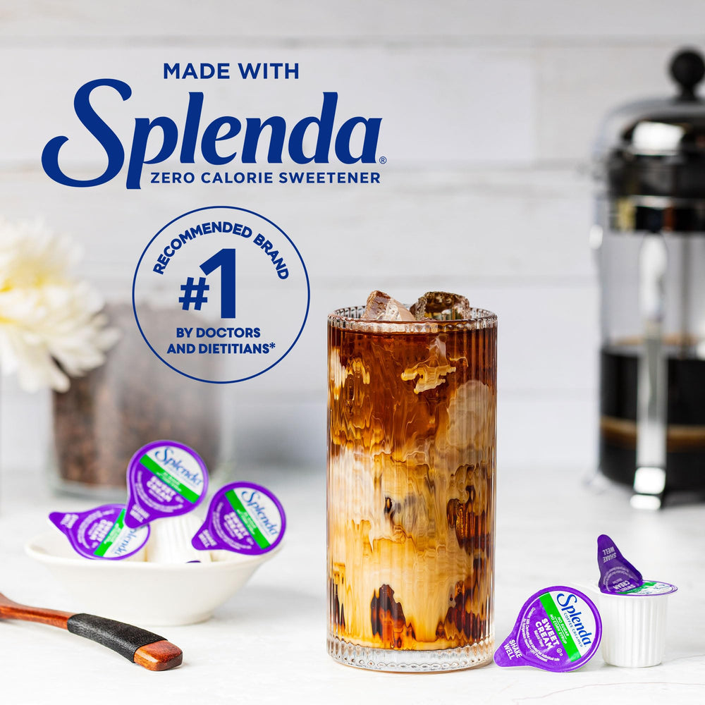 SPLENDA creamer being poured into a hot cup of coffee