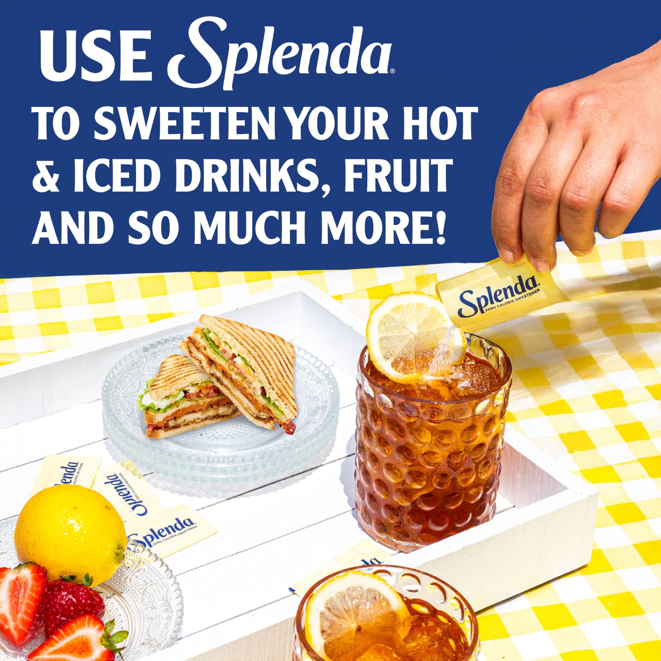 SPLENDA packets on a desk during a busy workday for convenient sweetness.