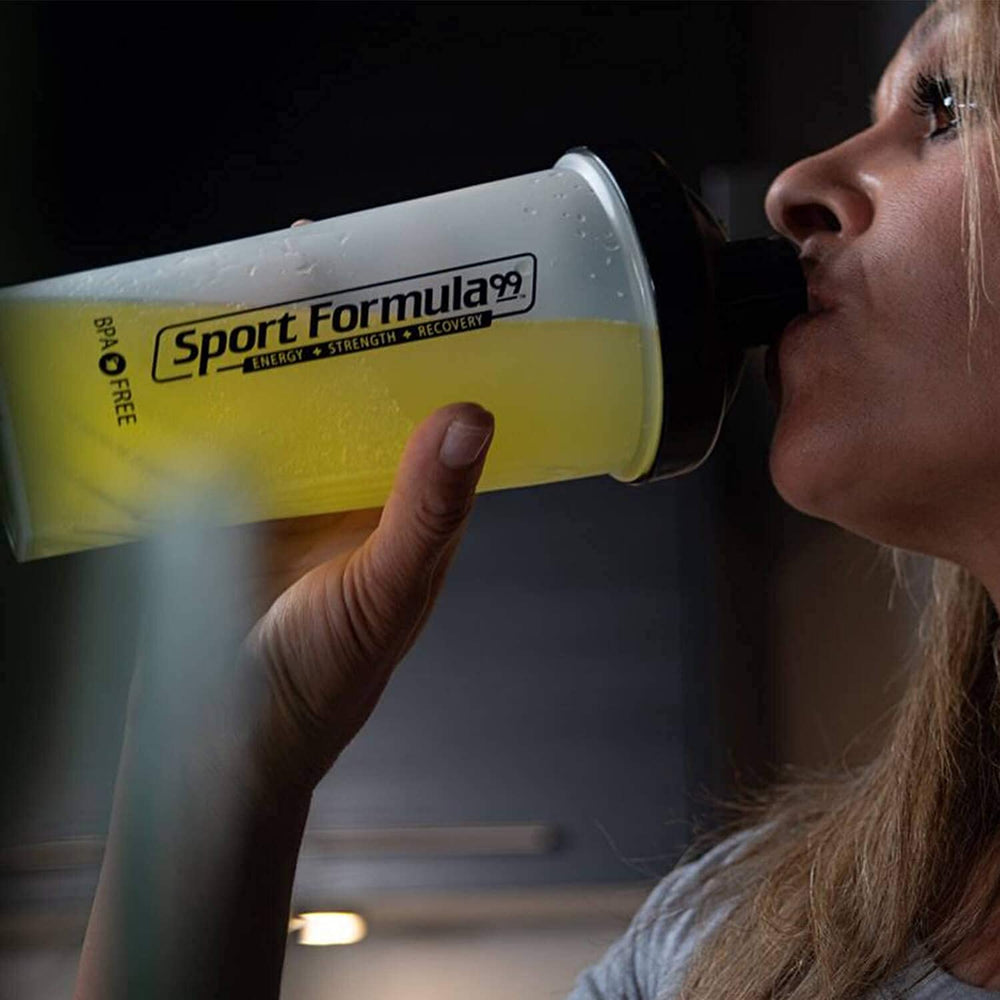Sport Formula 99 athlete prepares pre-workout drink with electrolyte support.