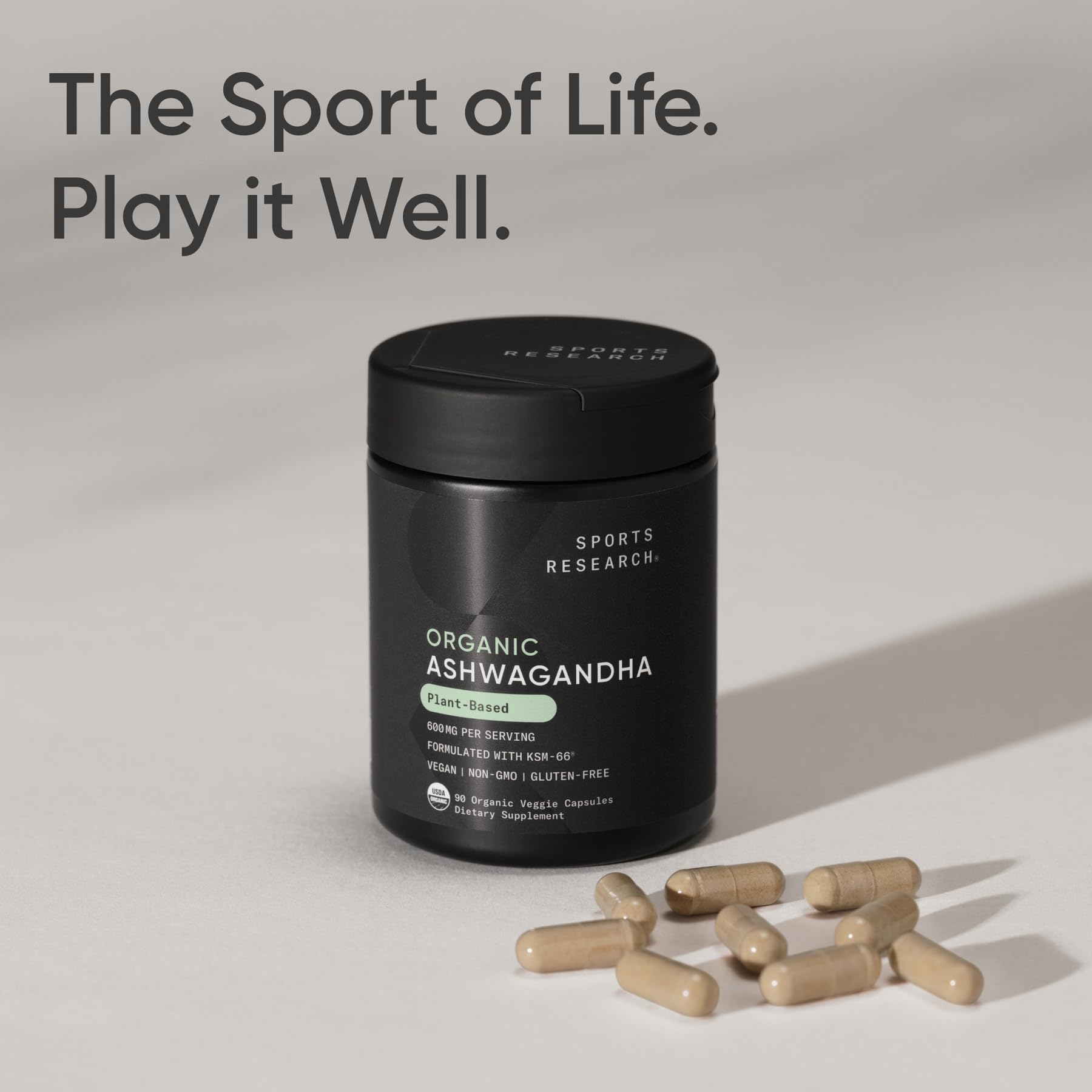 Sports Research Ashwagandha bottle beside glass, stress-relief ritual imagery.