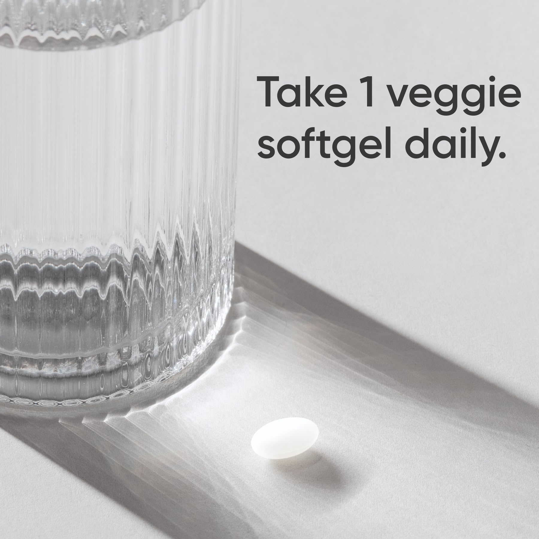 Close-up of the label showing vegan certification and non-GMO status.