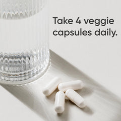 Close-up of Sports Research label on creatine capsules highlighting purity.