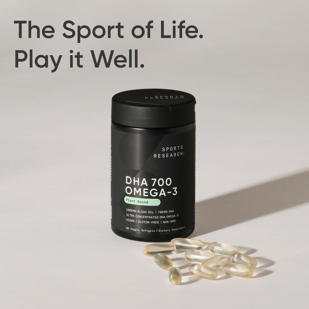 Sports Research vegan DHA softgels in hand for daily use.