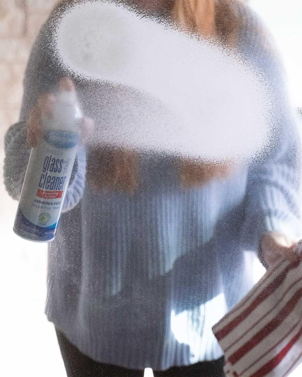 Sprayway Glass Cleaner on windshields and automotive glass for quick drying.
