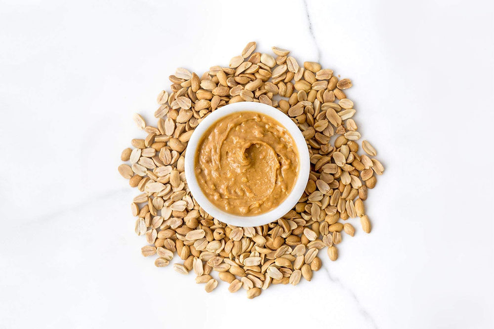 Ingredients shown on Spread The Love Naked Crunch—organic, non-GMO, no added sugar.