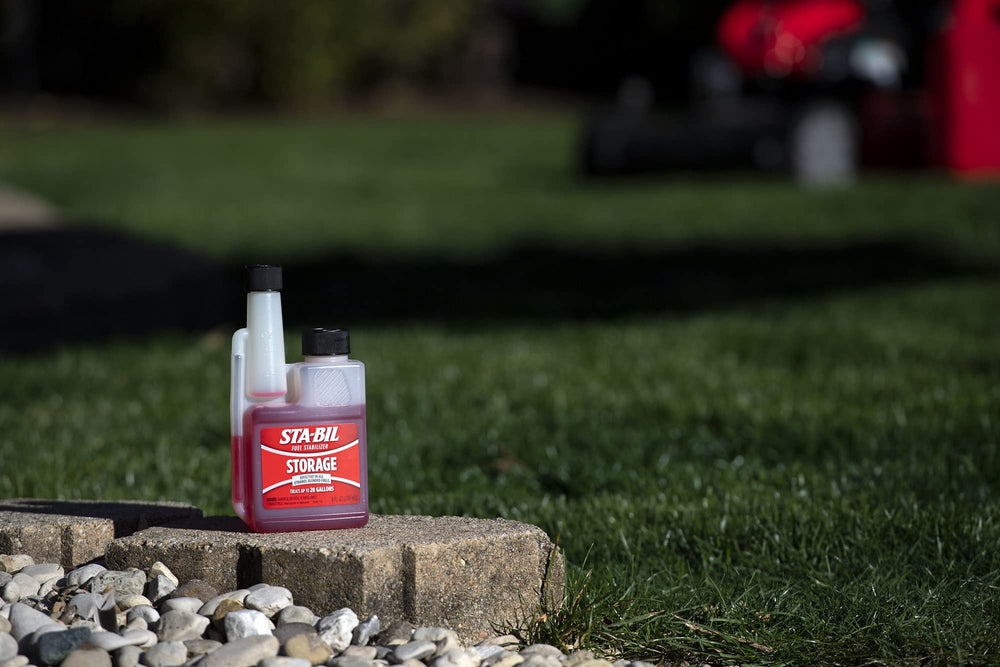 Bottle beside toolbox illustrating easy-start concept after storage.
