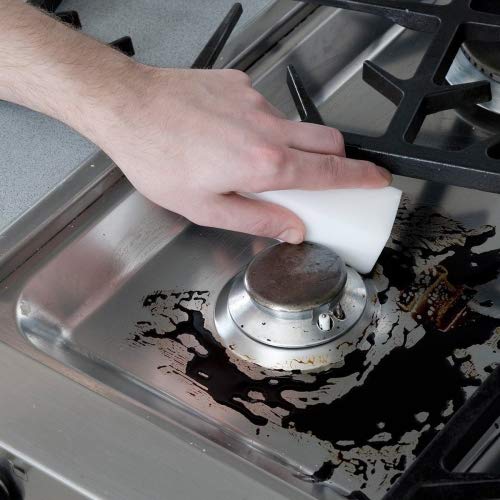 STK cleaning pad on metal surface for universal cleaning.