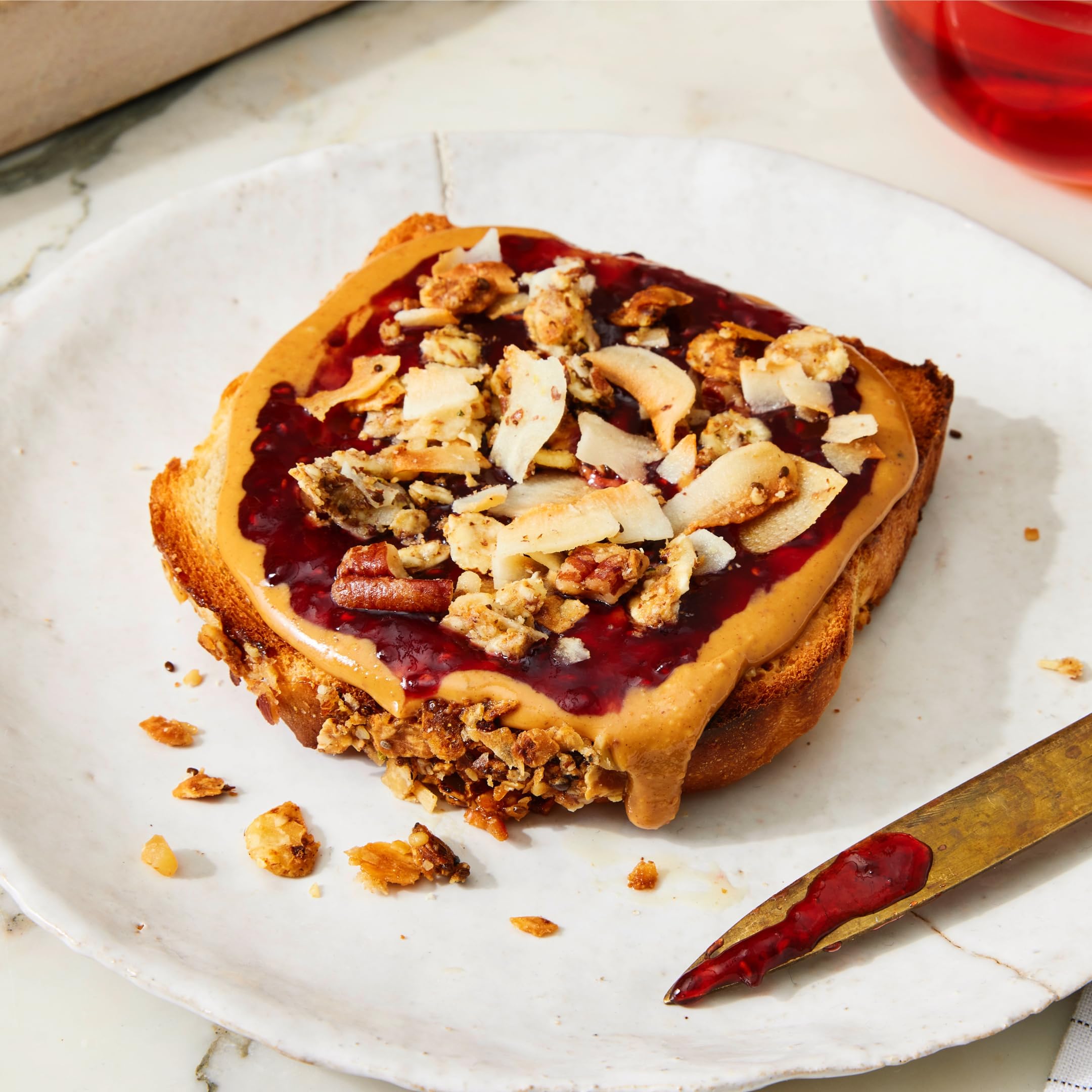 Struesli Original Granola on avocado toast adds crunch and nutrition