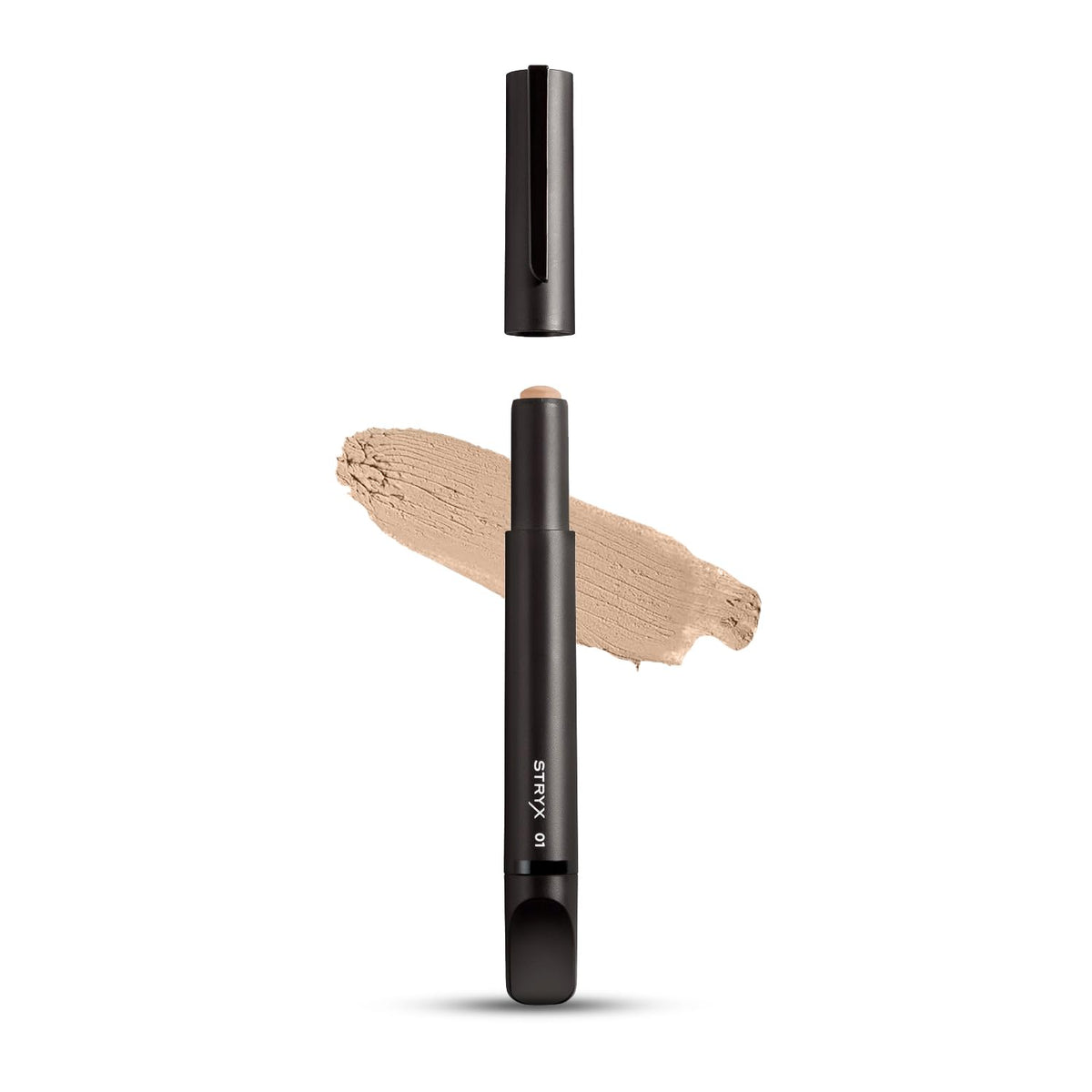 Stryx Concealer Tool in light cognac applied in hand for quick, natural concealing
