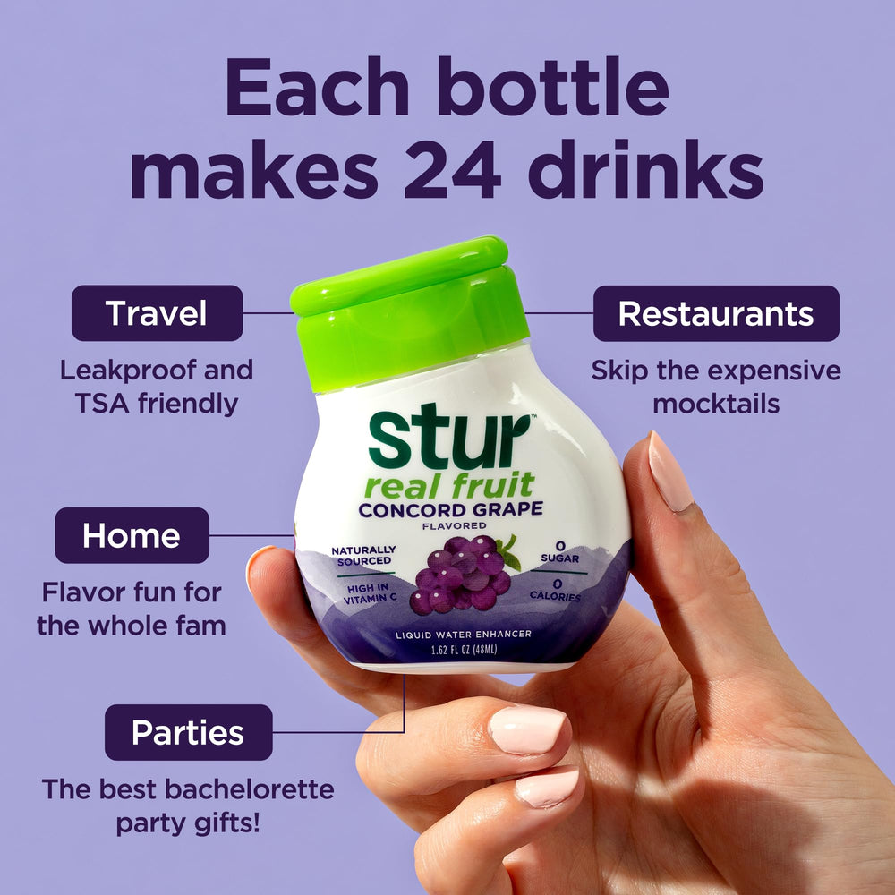 Stur Concord Grape drink mix with serving idea beside a water glass