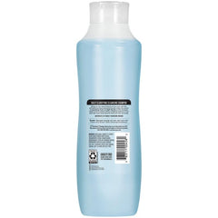 Close-up of Suave Clarifying Shampoo packaging emphasizes long-lasting fruity and floral scent