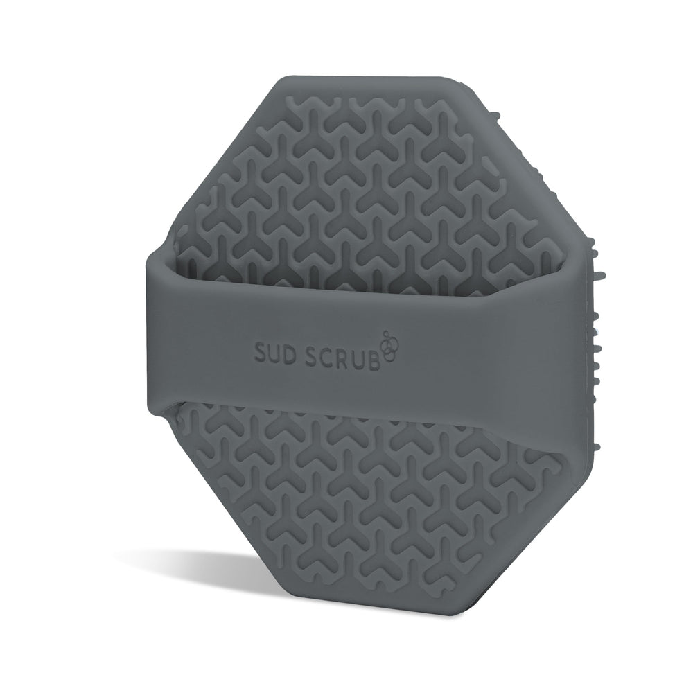 Sud Scrub Charcoal Face Scrubber with finger strap in action during shower routine.