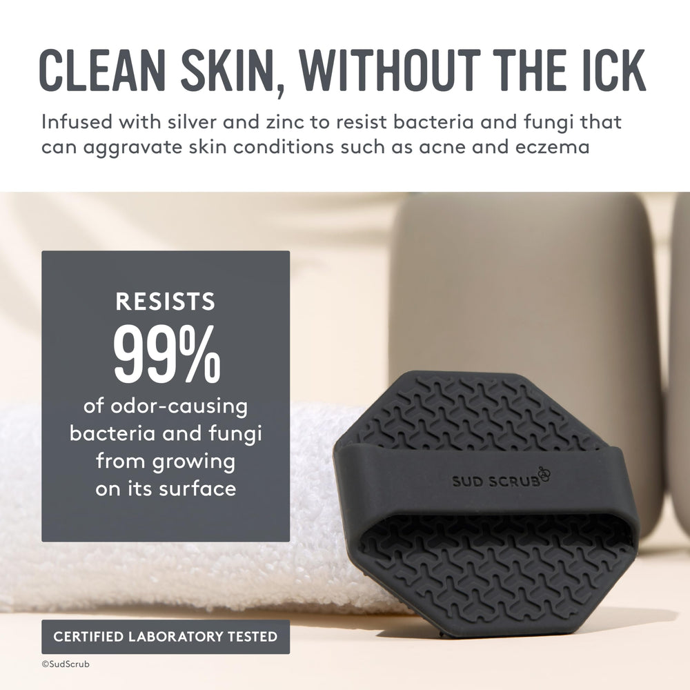 Sud Scrub Charcoal Face Scrubber held in hand showing non-slip grip for secure scrubbing.