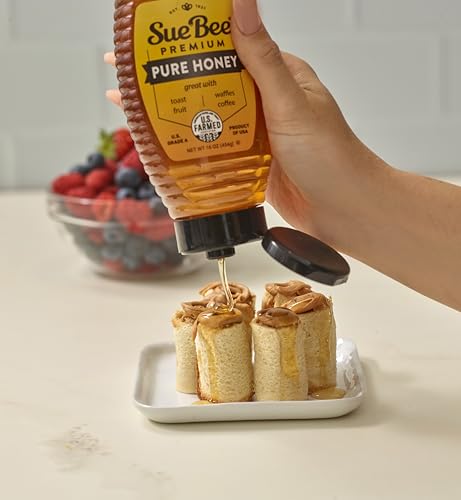 Closeup of Sue Bee honey jar showing golden amber color and clarity.