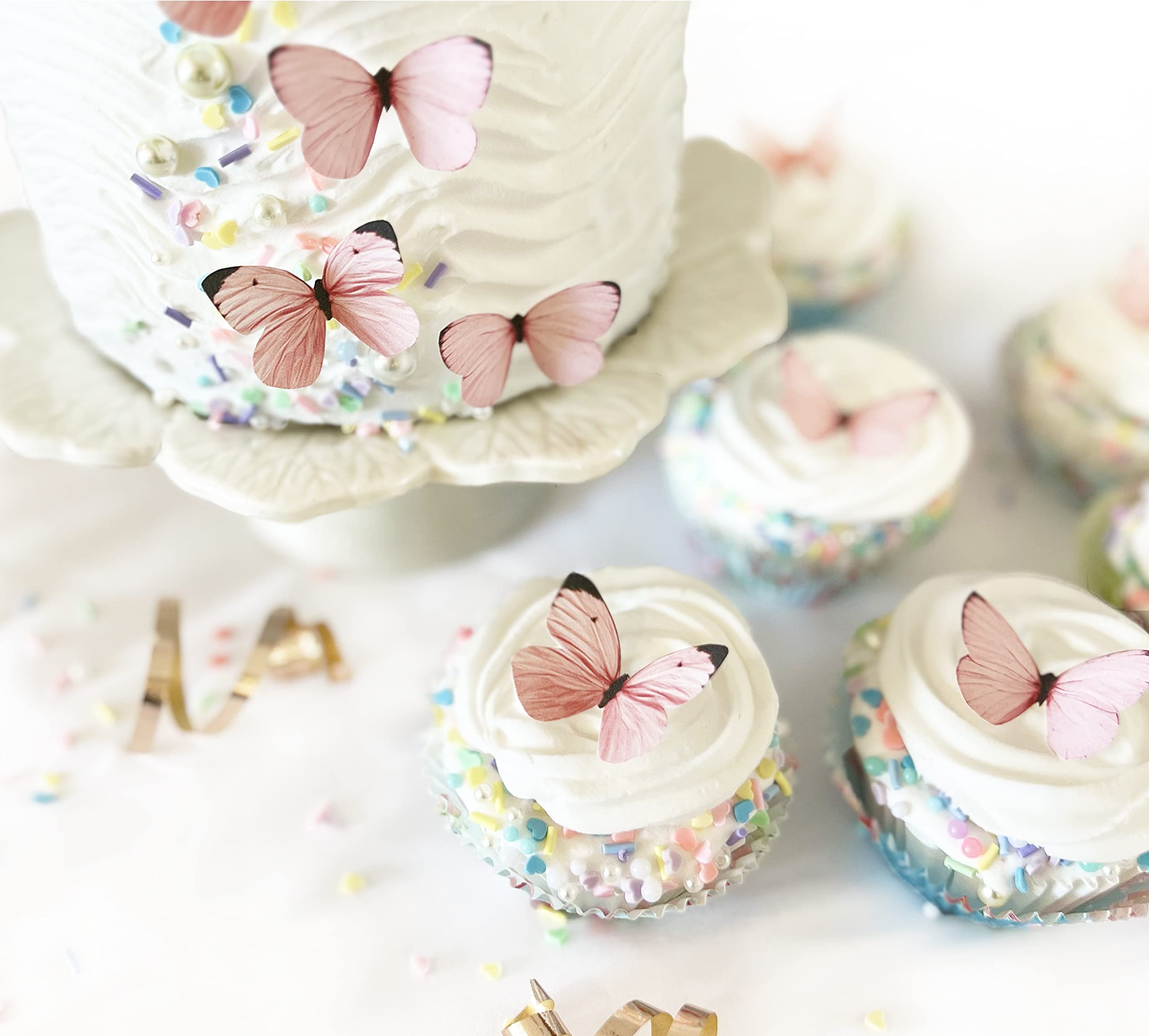 Sugar Robot edible butterfly cake toppers pastel pink for elegant cupcake accents.