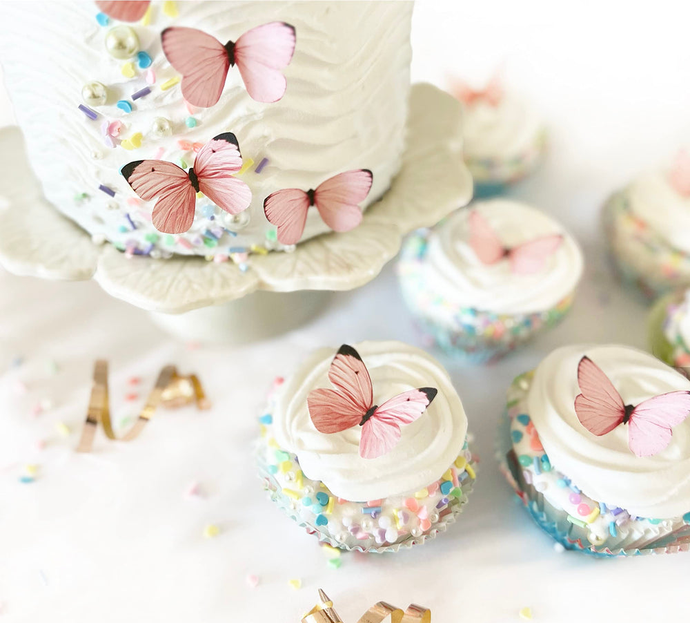 Sugar Robot edible butterfly cake toppers pastel pink for elegant cupcake accents.