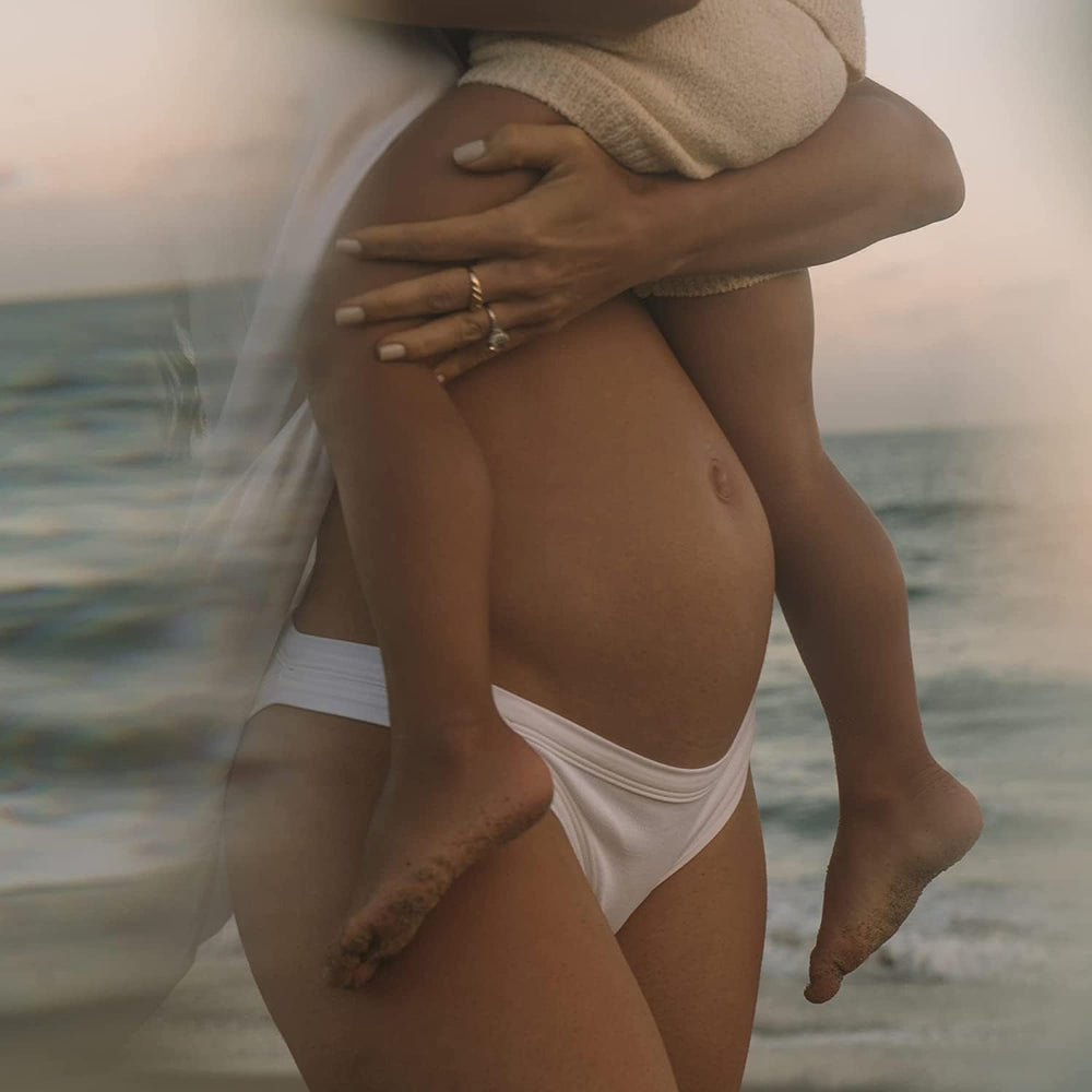 Massage into skin with Summer Fridays Babymoon Belly Balm for soothing moisture.