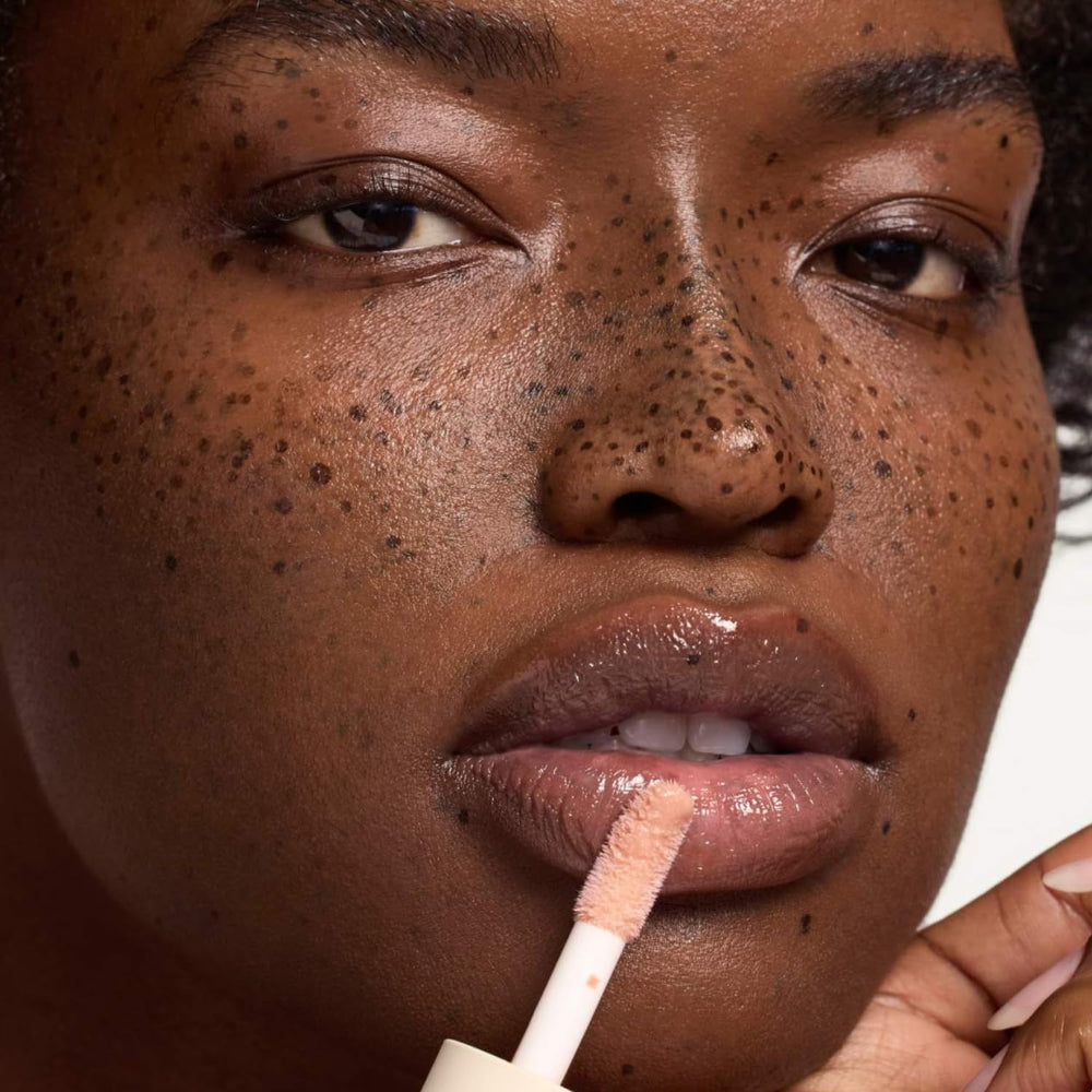Summer Fridays Dream Lip Oil bare lips shown with softened, supple look.