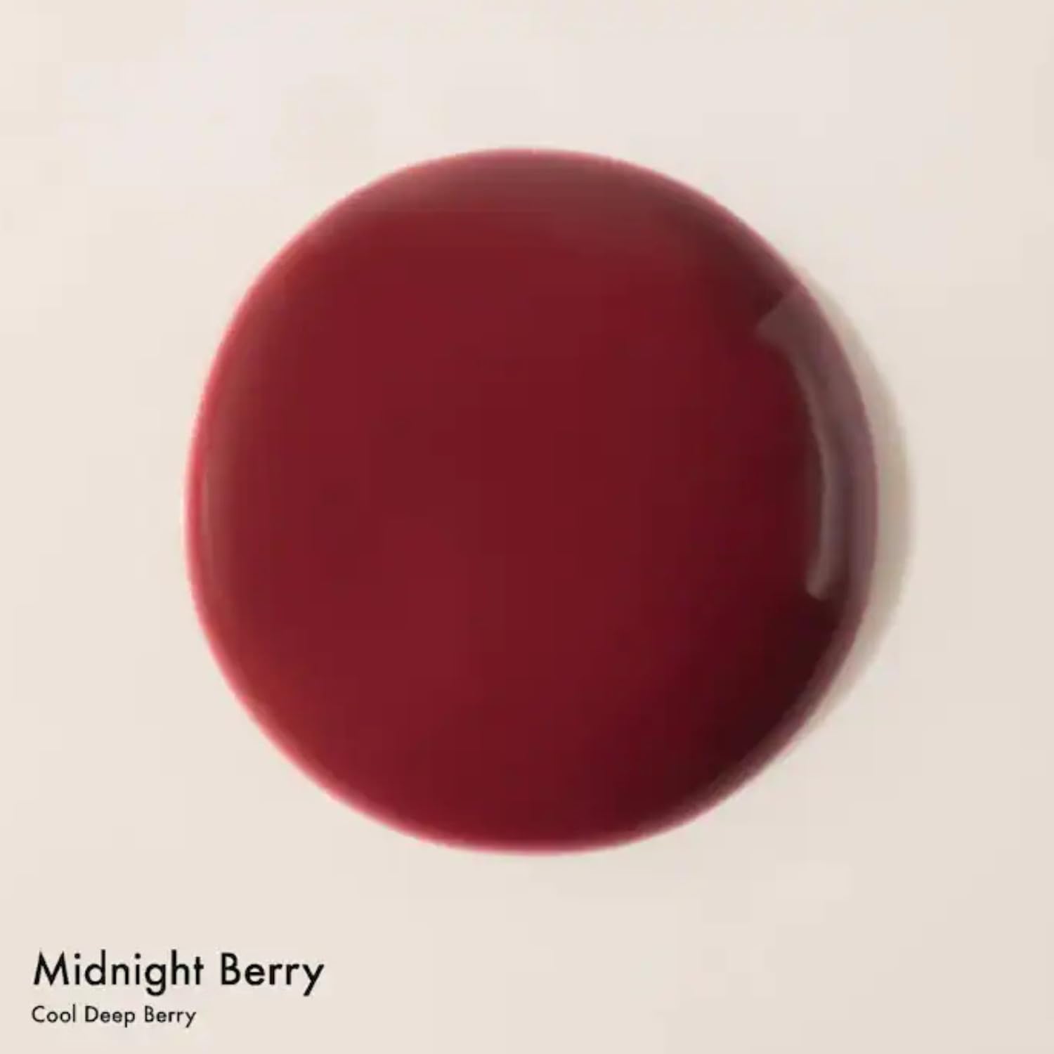 Summer Fridays Dream Lip Oil Midnight Berry on lips, delivering moisture and shine.