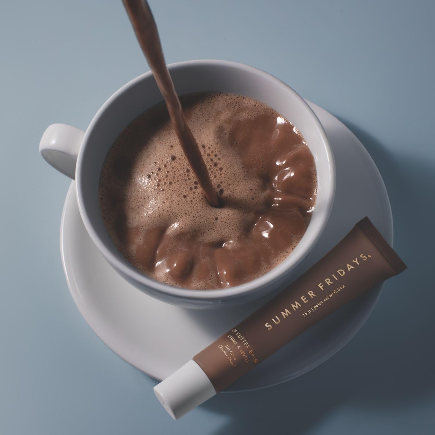 Hot Cocoa lip balm on lips adds warm glow and moisture.