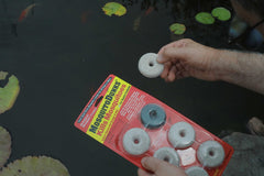 Summit Mosquito Dunk Tablet in use, treats standing water for larval control
