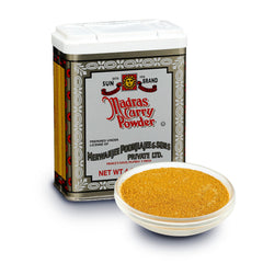 Sun Brand Madras Curry Powder jar close-up showing vibrant color for flavorful curries.