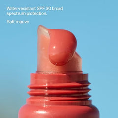 Sun Bum Bonfire tinted lip balm on lips delivering lightweight color and moisture.